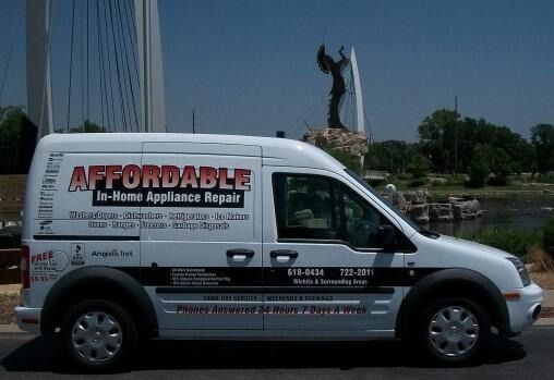 White service van with “Affordable” appliance repair advertising, parked outdoors near a fountain statue.