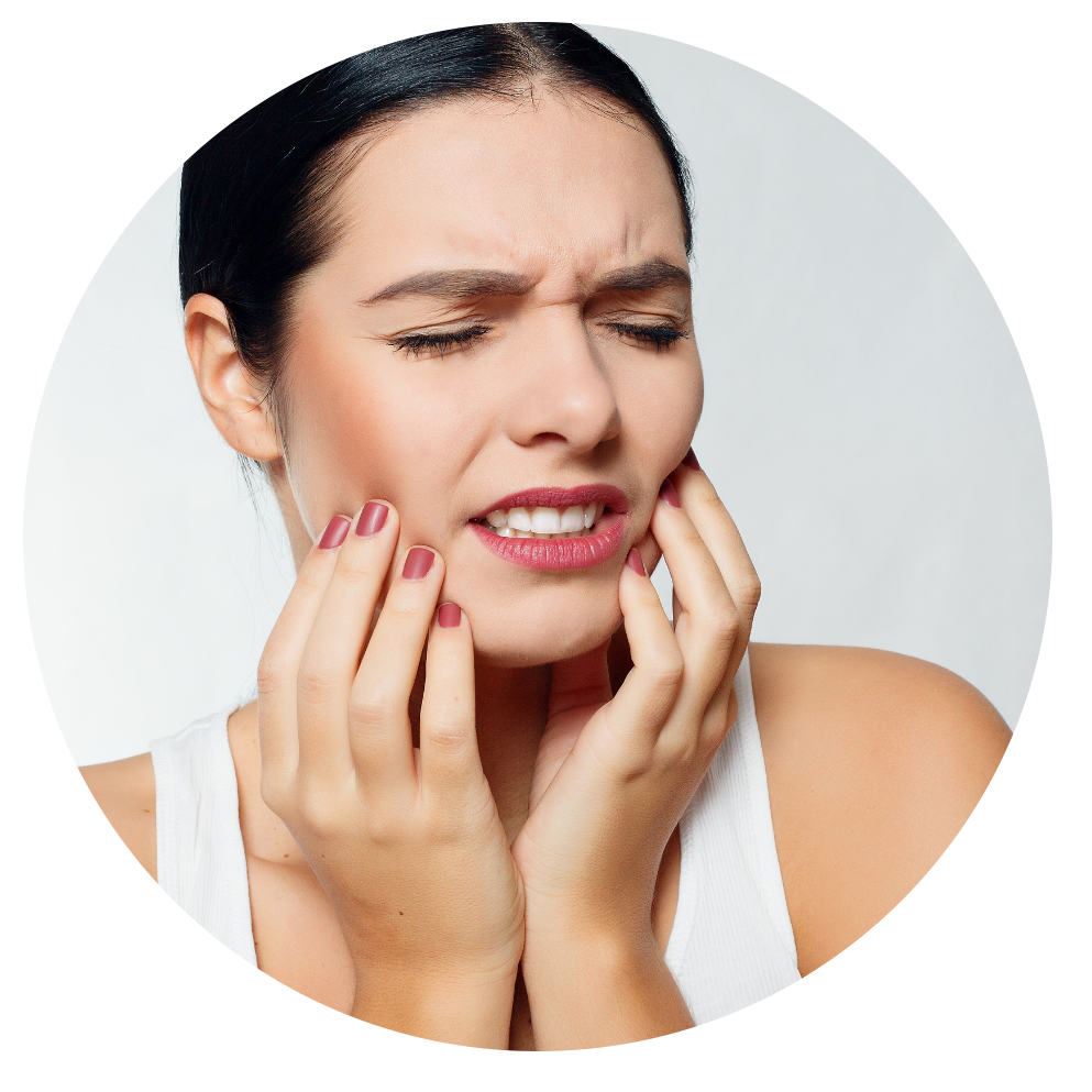 A woman is holding her face in pain because of a toothache.