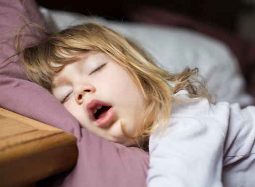 A girl sleeping with her mouth open.