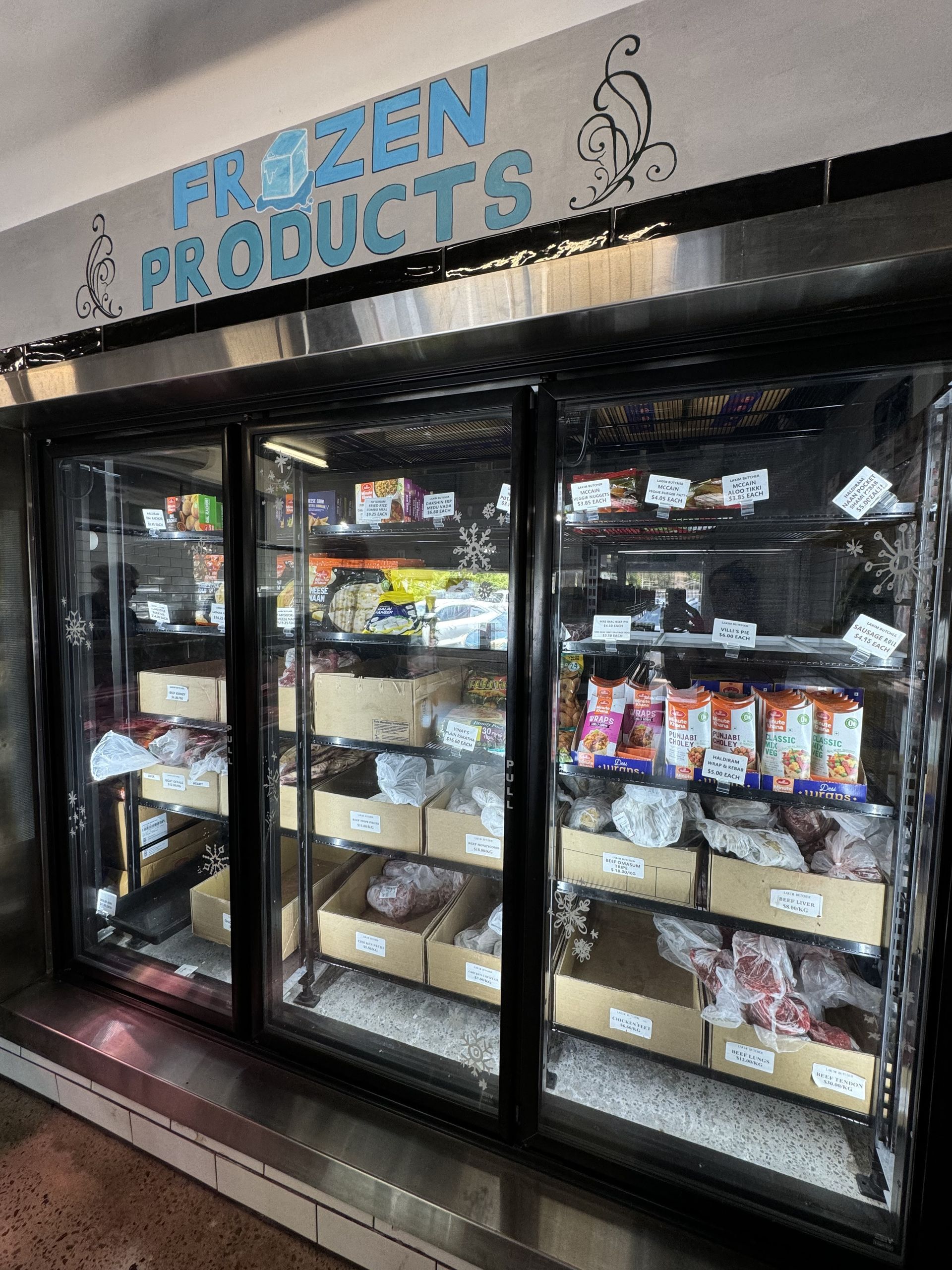A Refrigerator Filled With Frozen Products In A Store — Lakim Butcher In Parap, NT 
