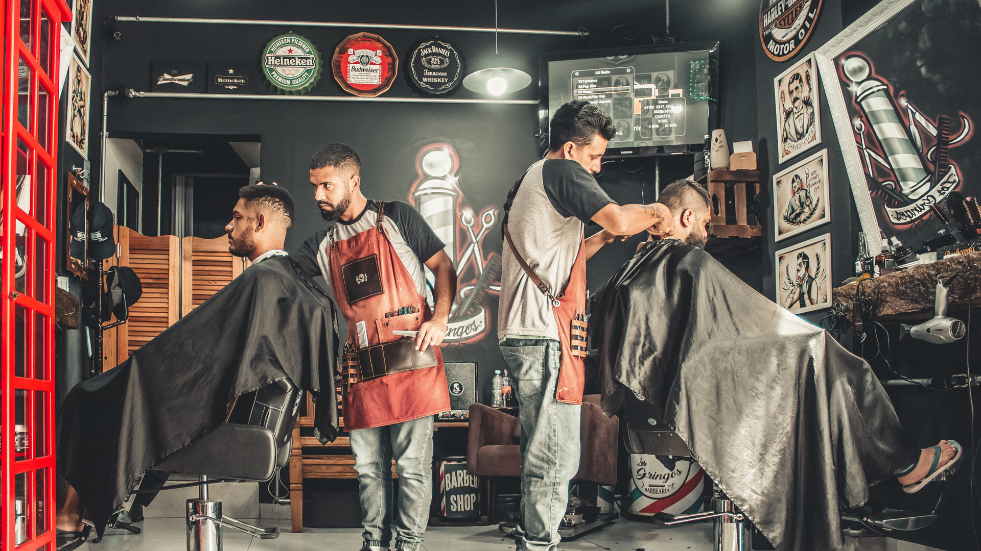 A barbershop with new clients that are happy