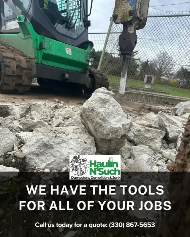 A green skid steer with a hydraulic hammer breaking concrete. Ad text for Haulin N' Such with phone number (330) 867-5653.
