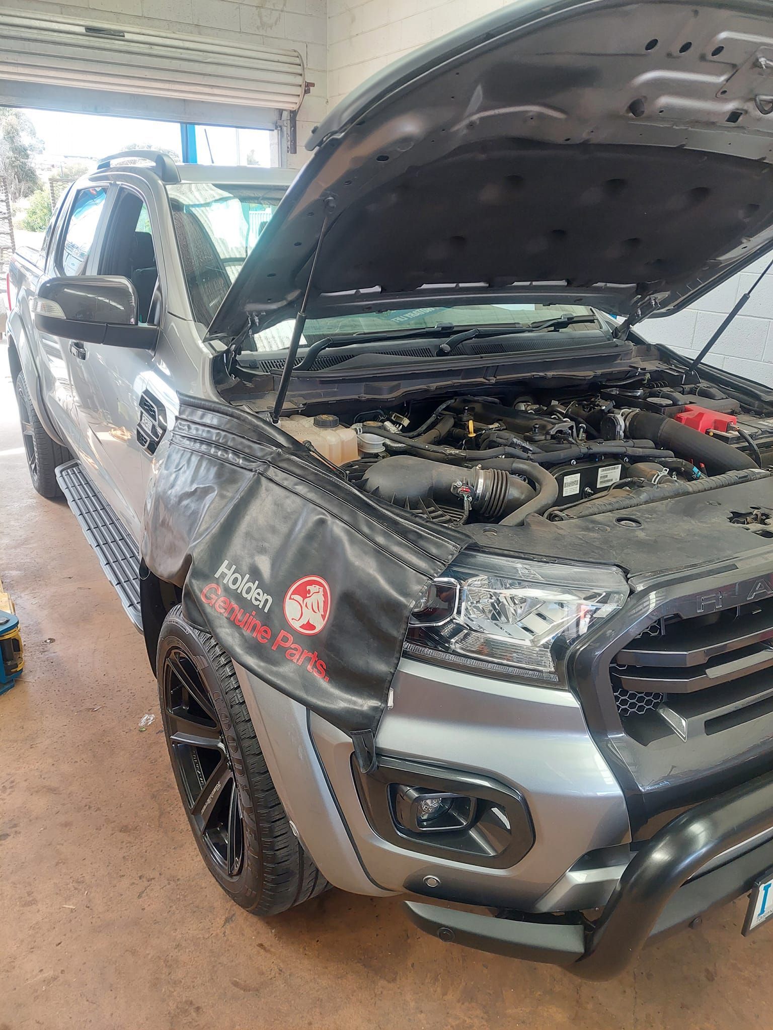 A Silver Pickup Truck Parked in a Garage With Its Hood Open — TasMech Auto Services In Mornington, TAS