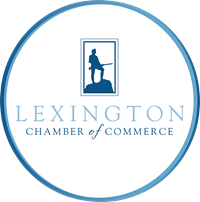 Lexington Chamber of Commerce logo: Minuteman silhouette in a blue frame, inside a blue circle. 