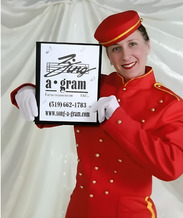 Woman in a red uniform holding a sign that says