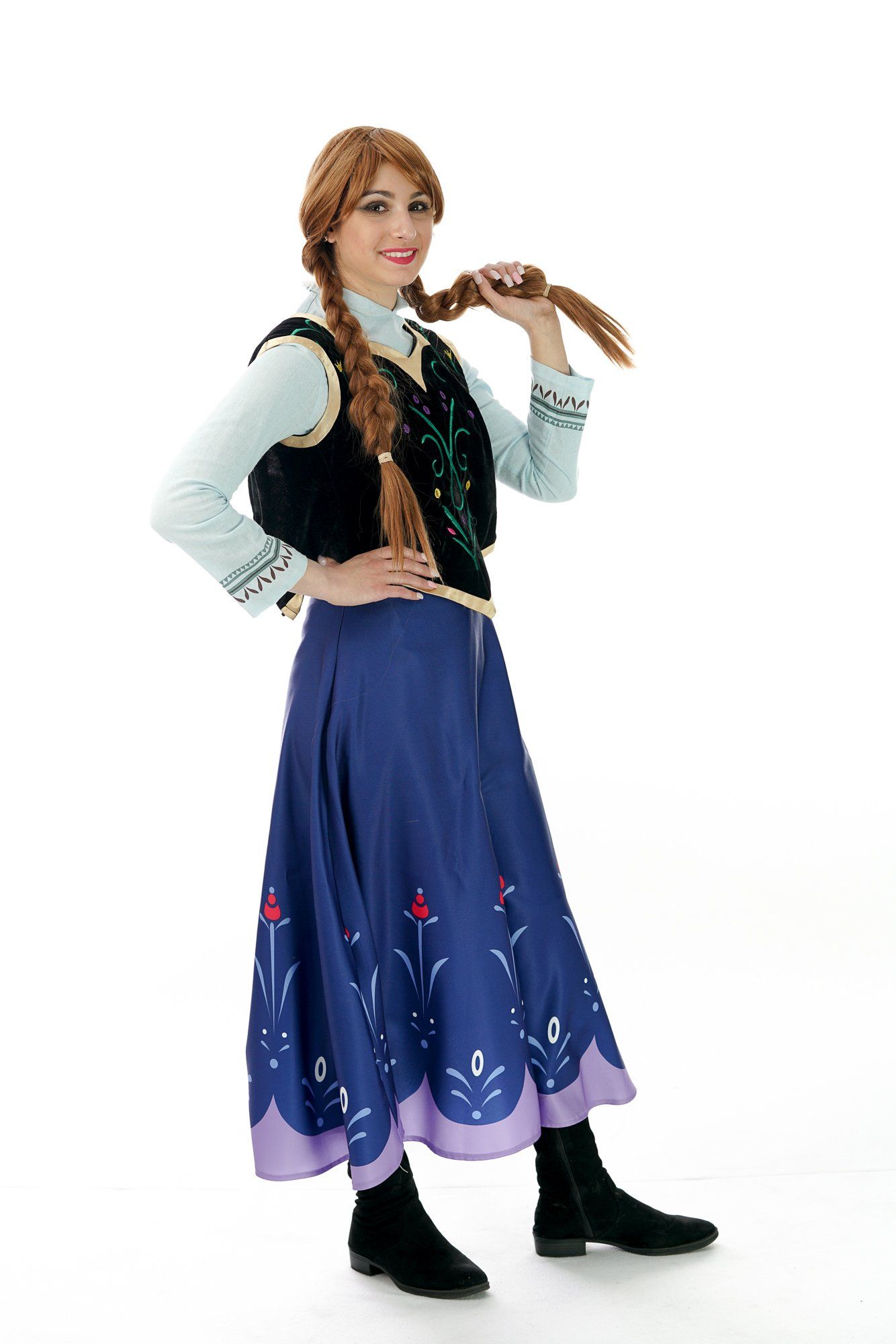 Person in Anna (Frozen) costume, posing, braids, blue skirt, black vest.