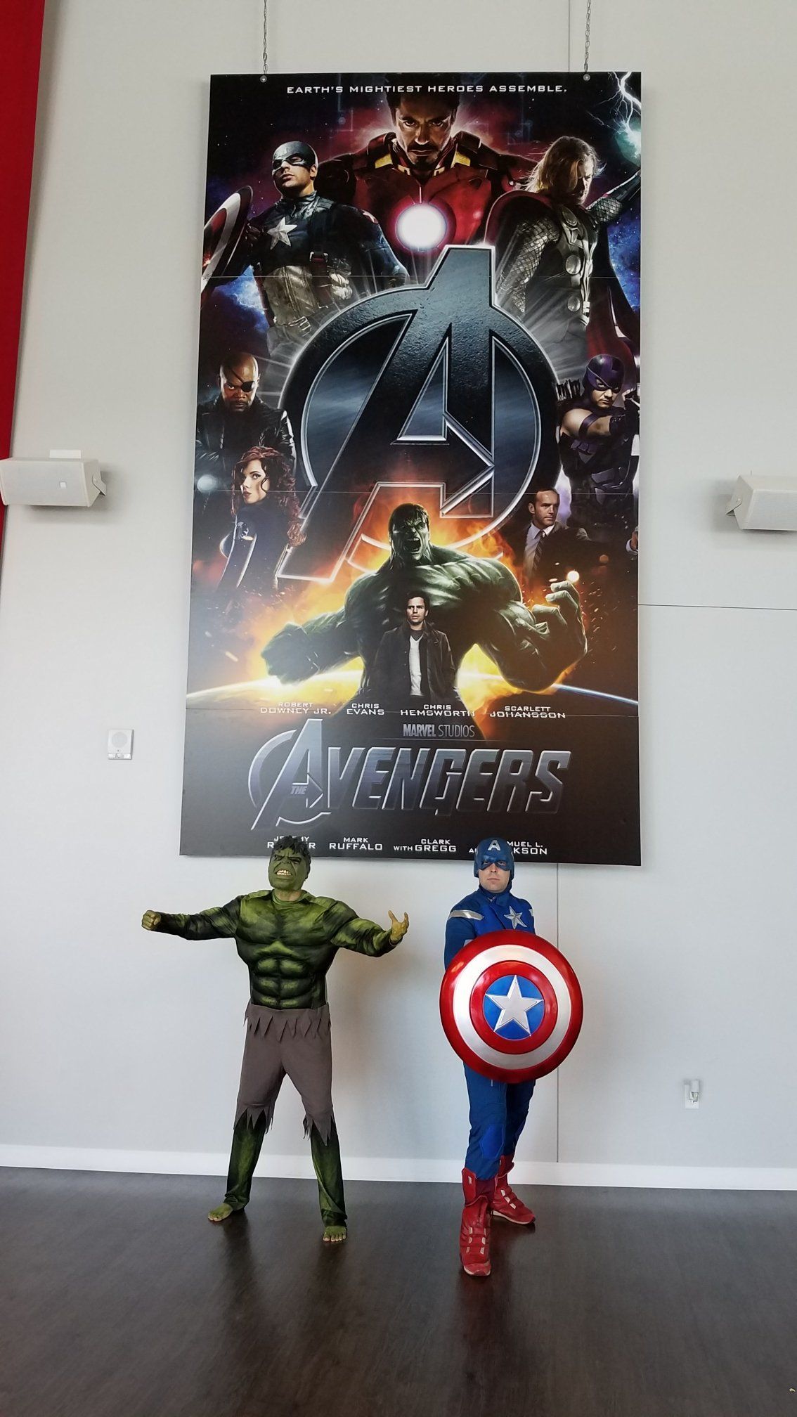Hulk and Captain America figures stand before 