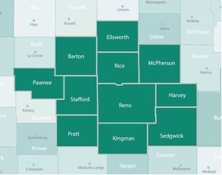 A map of central Kansas counties, with a cluster of ten counties highlighted in dark green against a light background.