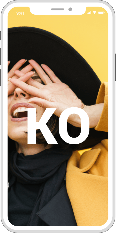 Person covering their face with hands on a yellow phone screen with large “KO” text