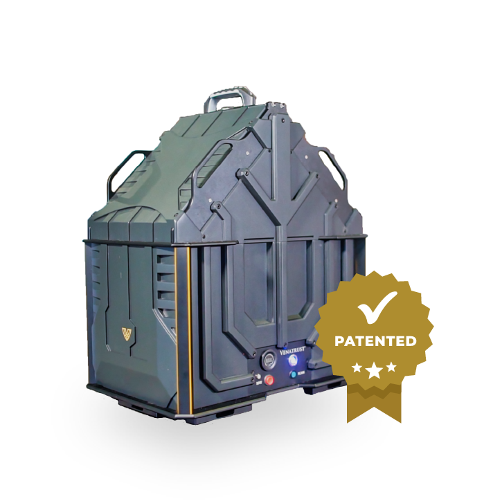 A dark olive-green, rugged, modular storage container with handles and a circular control panel, featuring a patent seal.