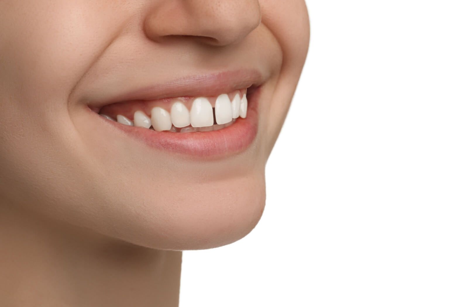 A close-up of a person's smile showcasing a visible gap, or diastema, between their two front upper teeth.