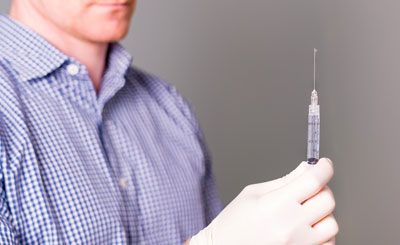 A fine needle, local anaesthetic mixed in