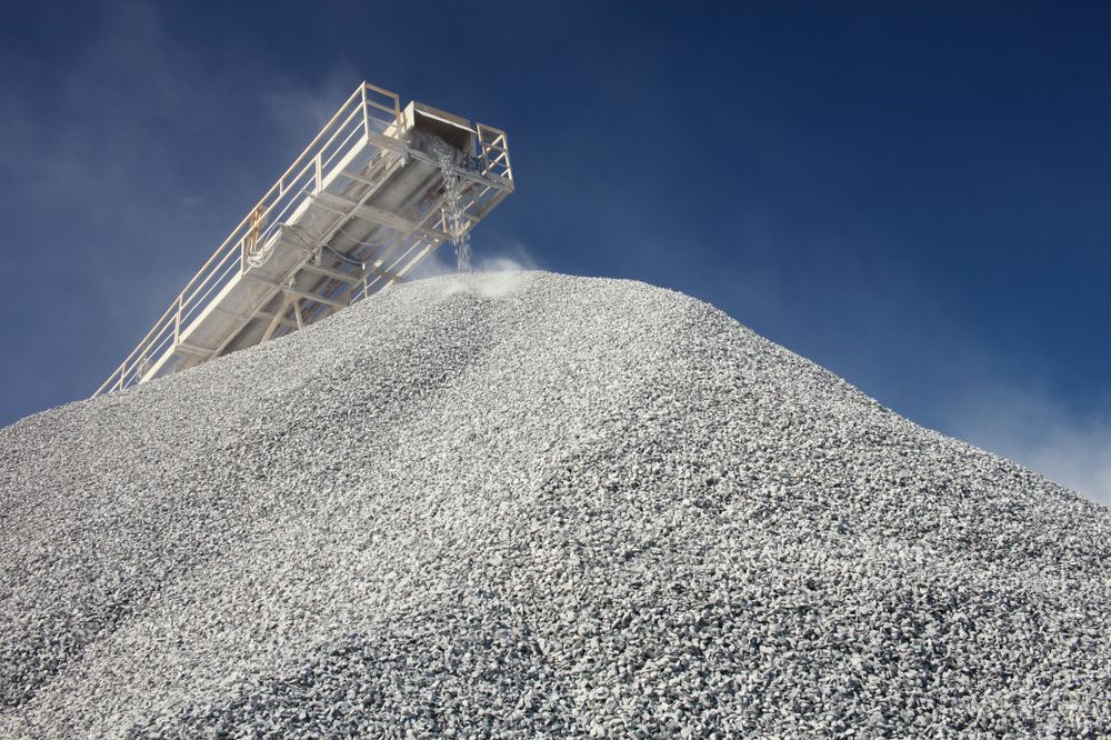 A Large Pile of Gravel With a Conveyor Belt on Top of It — Hothams In Bathurst, NSW