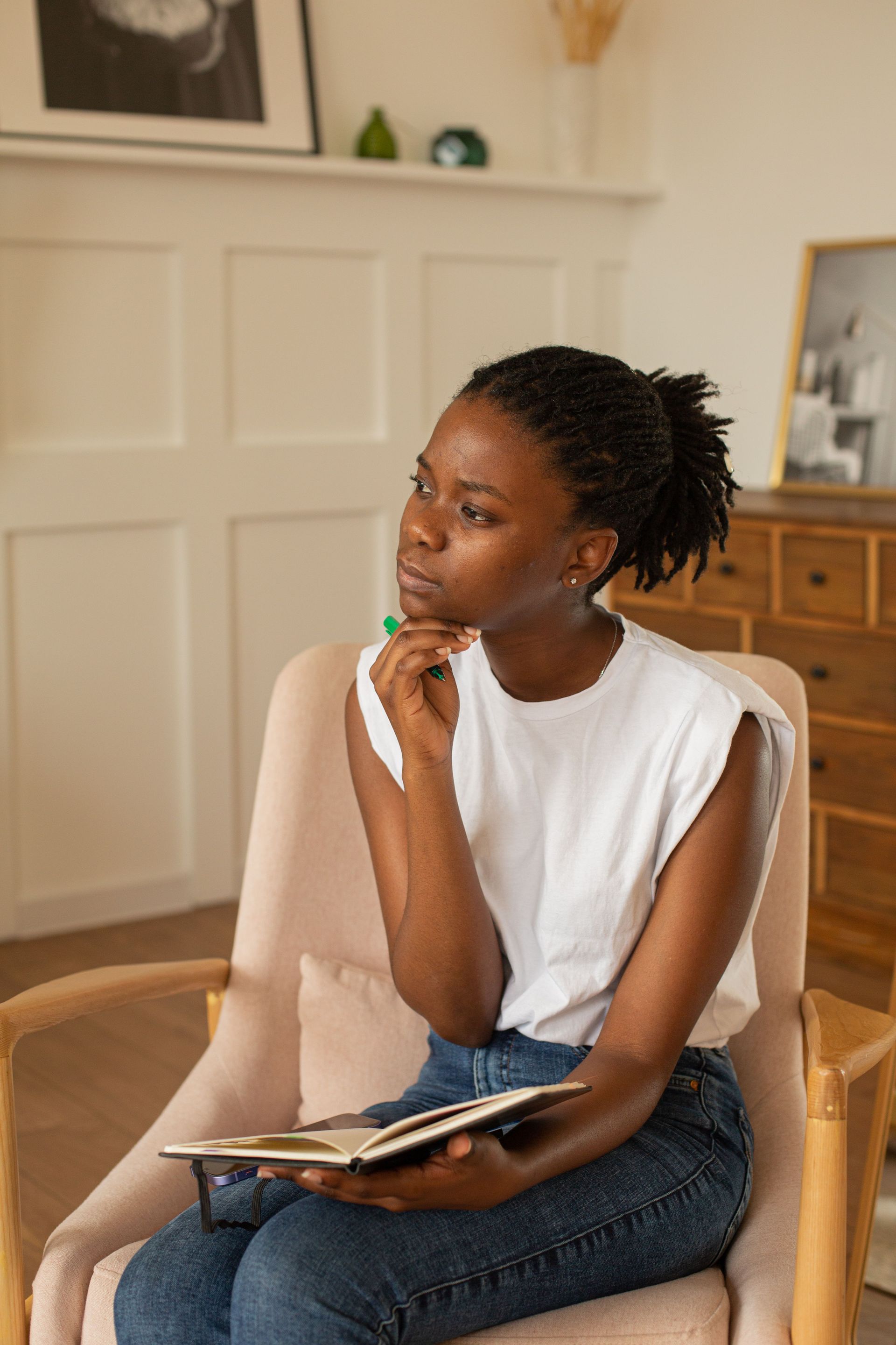 Woman reflecting on setting healthy boundaries and overcoming people-pleasing patterns in therapy