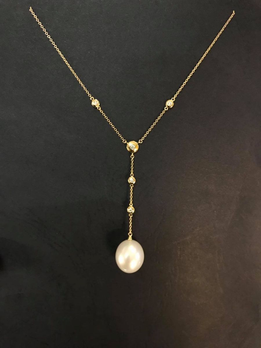 Gold Necklace With a Pearl Pendant and Small Diamonds — Chris Williams Retail & Manufacturing Jewellers in Wanguri, NT