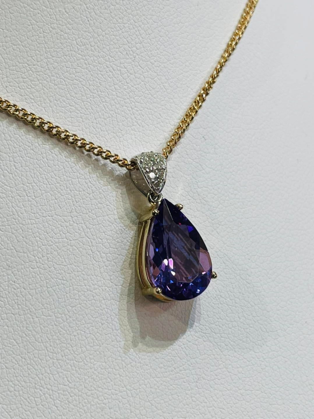 Gold Necklace With a Pear-shaped Purple Gemstone Pendant — Chris Williams Retail & Manufacturing Jewellers in Wanguri, NT