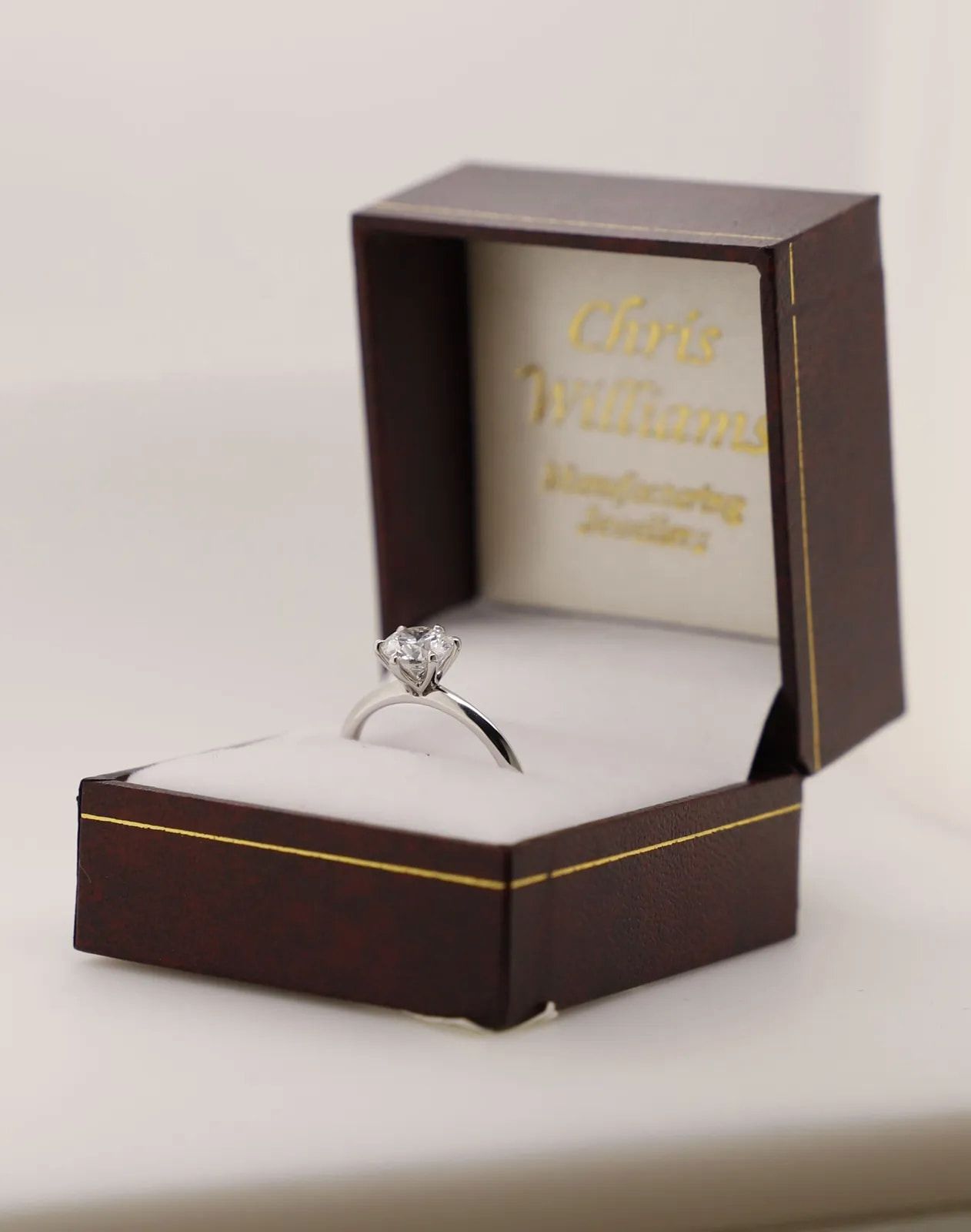 Diamond Ring in a Dark Wood Jewelry Box With Gold Trim — Chris Williams Retail & Manufacturing Jewellers in Wanguri, NT