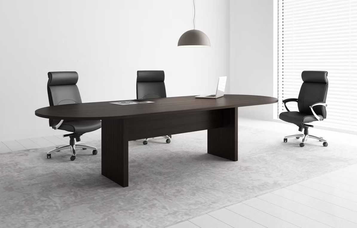 A conference room with a long table and chairs