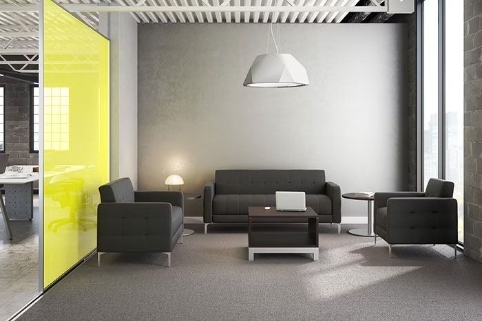 A living room with a couch , chairs , and a table.