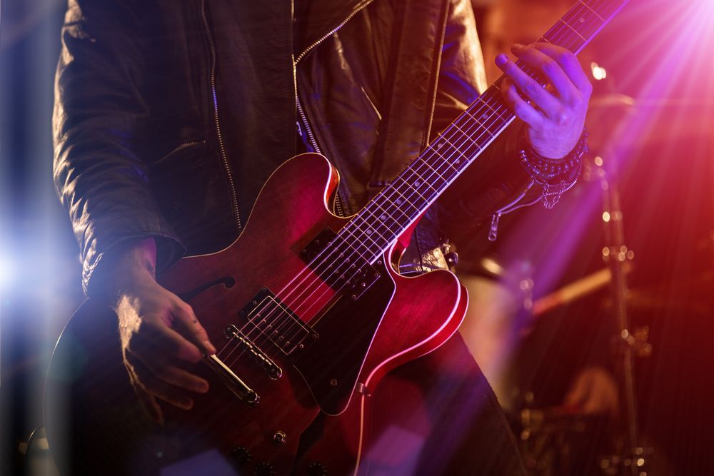 Person Playing Electric Guitar