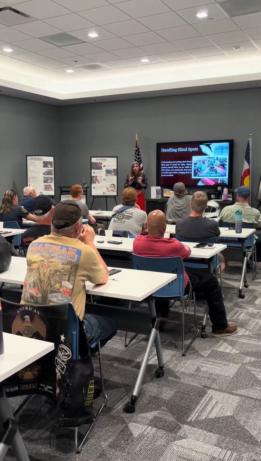 Avenir Consulting instructor leading classroom session on blind spots and situational safety