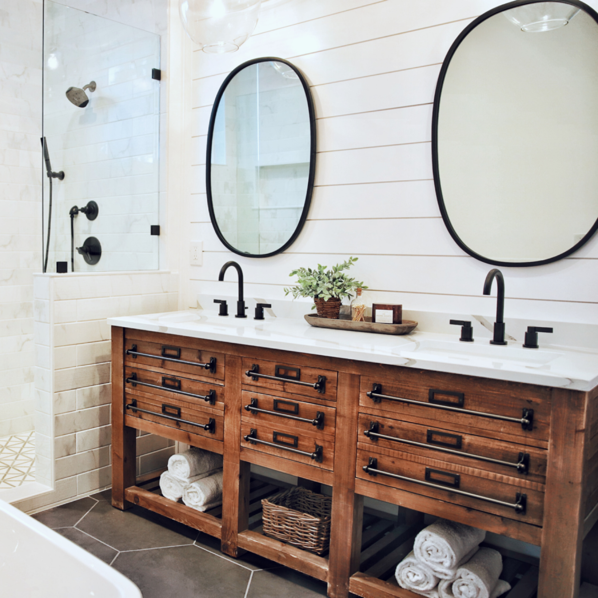 custom guest bathroom with double vanity and two mirrors