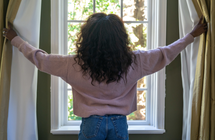 women looking out of window
