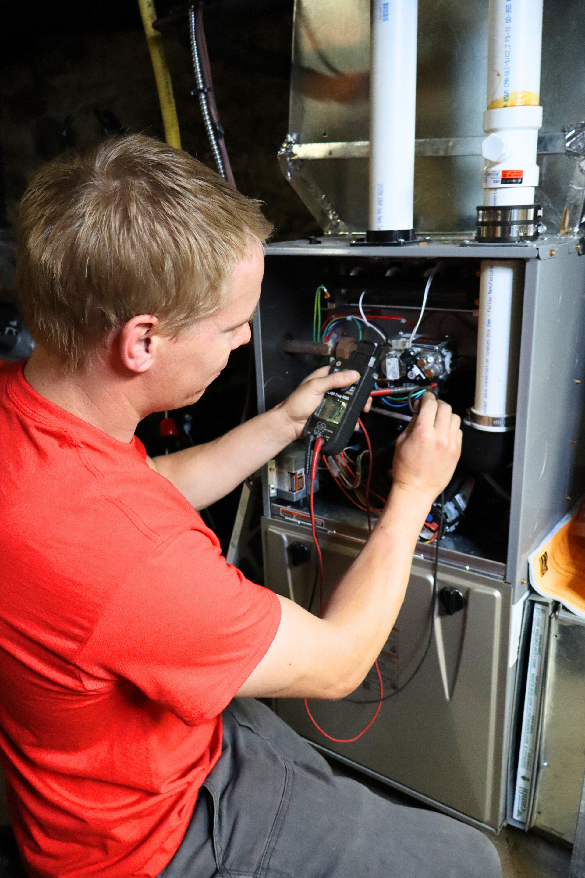 Ottawa heating technician working on furnace
