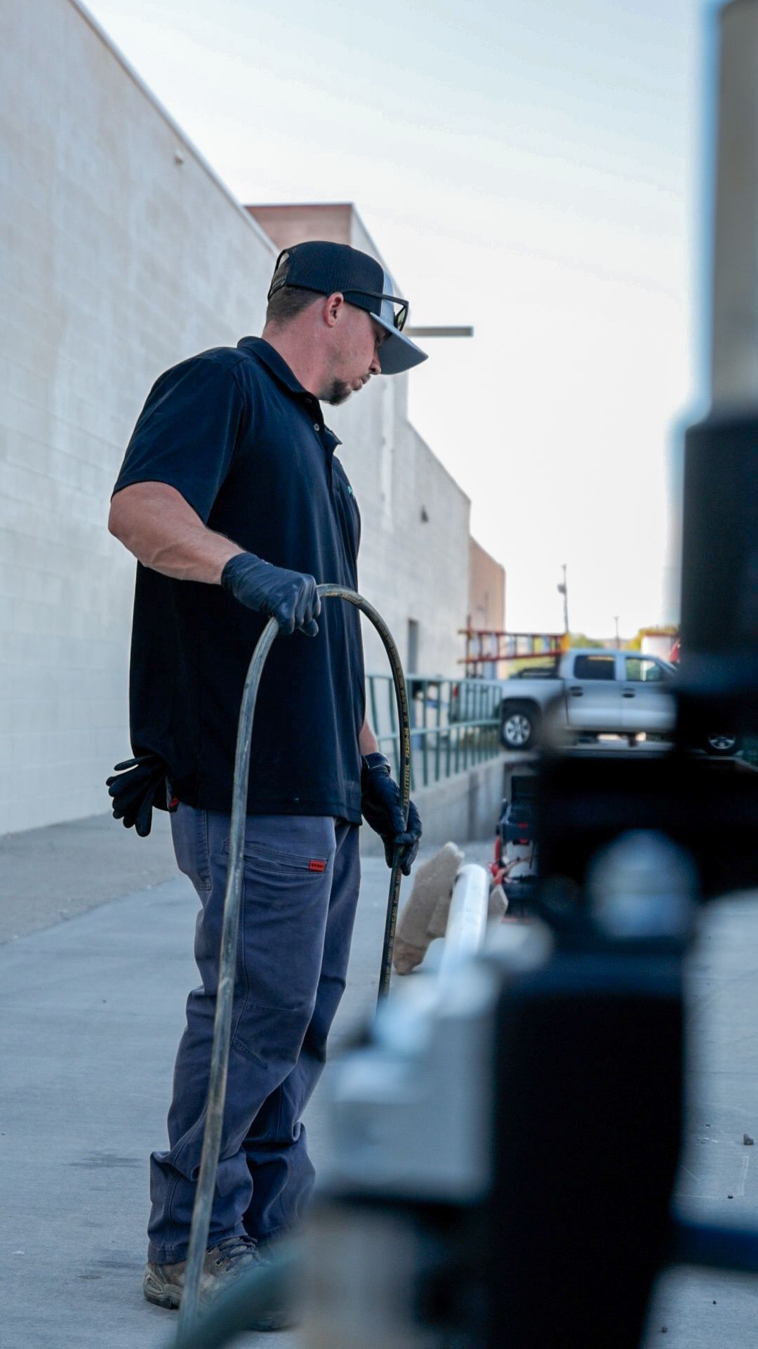platinum plumbing employee is using the sewer jetter at a commercial building