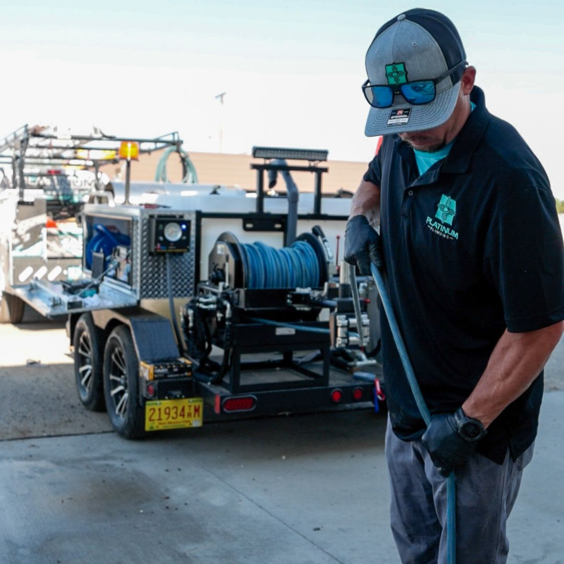 Platinum Plumbing employee demonstrating there Sewer Jetter