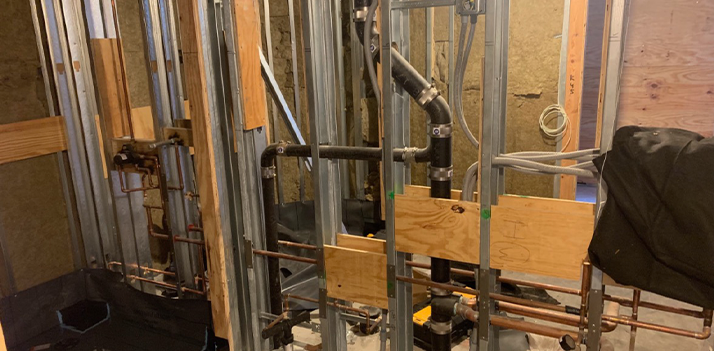 A room with a lot of pipes and wires in it.