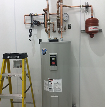 A yellow ladder is next to a water heater