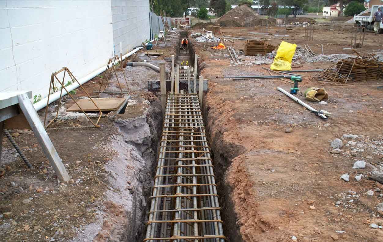 A construction site with a yellow bag on the ground