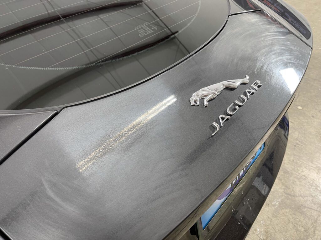 A close up of the back of a jaguar car