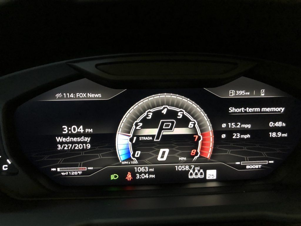 A car dashboard shows the time as 3:04 on wednesday 3/27/19