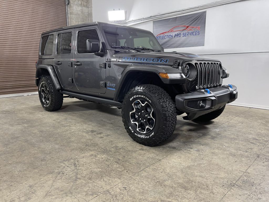 A jeep wrangler unlimited is parked in a garage.
