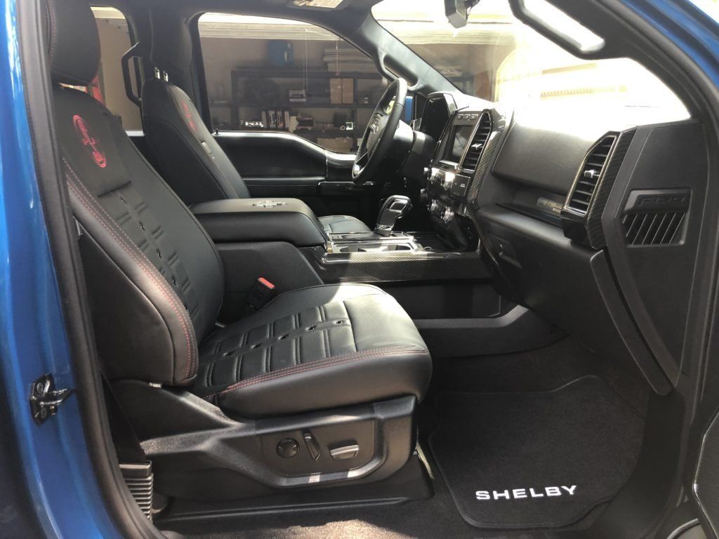 The interior of a blue shelby pickup truck