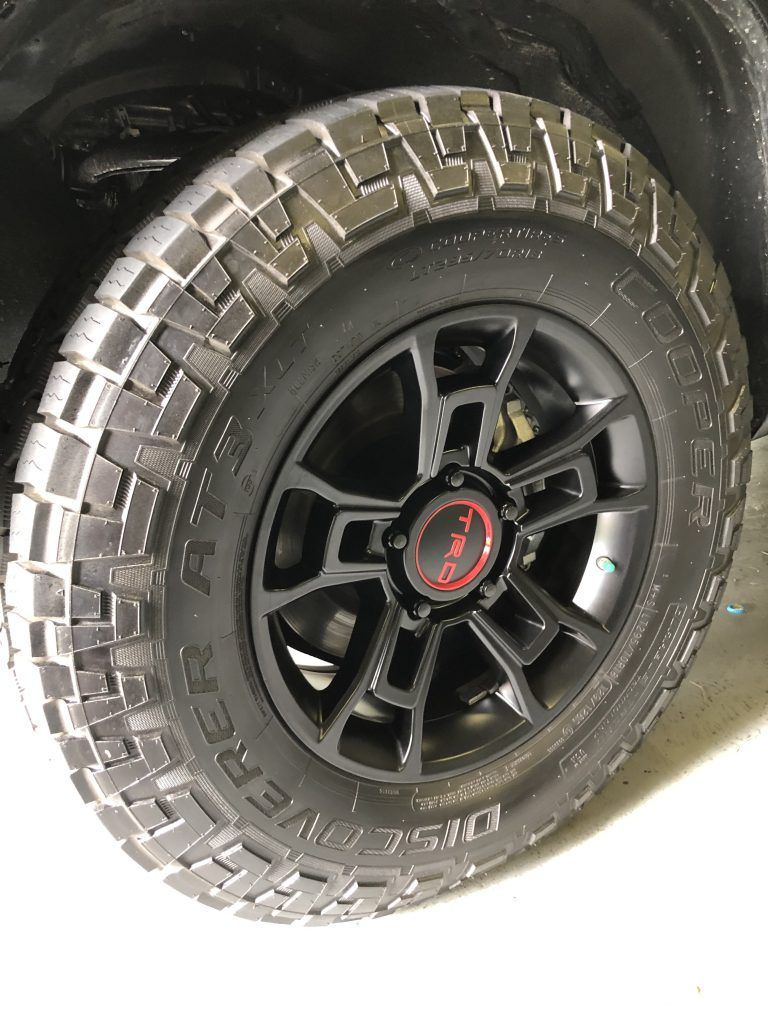 A close up of a tire and wheel on a truck.