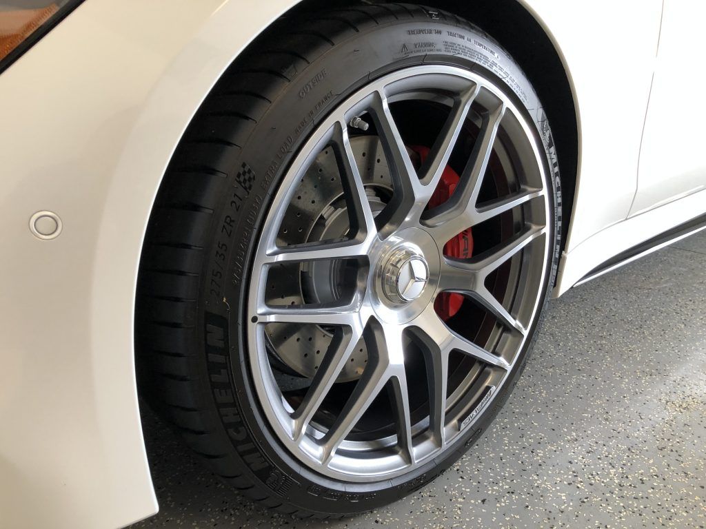 A close up of a car wheel with a tire on it