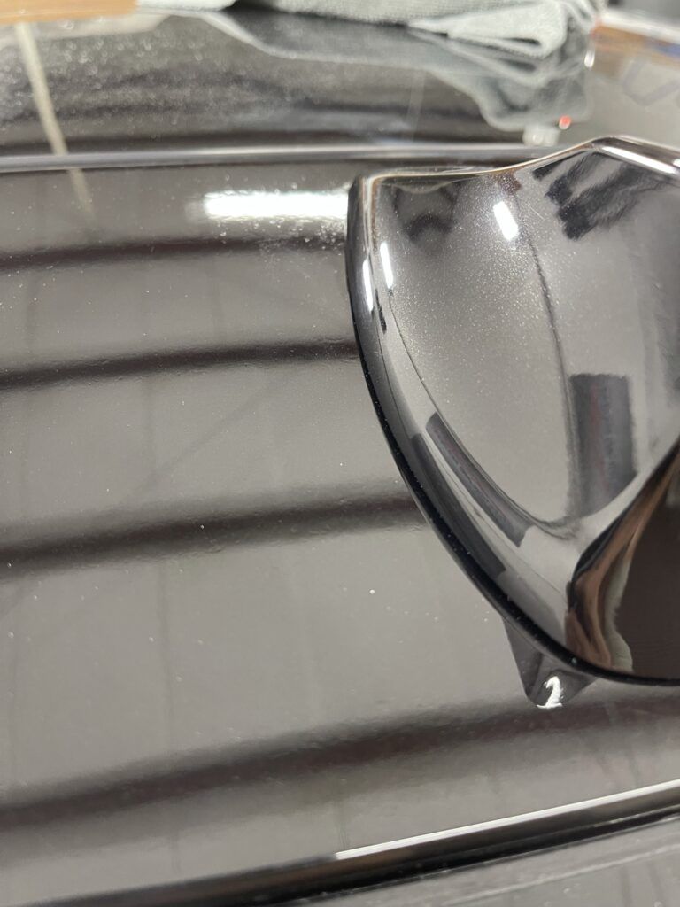 A pair of sunglasses is sitting on top of a black table.