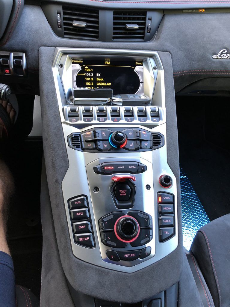 A close up of a car dashboard with a radio on it