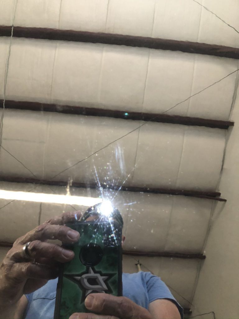 A person is taking a picture of themselves in a mirror.