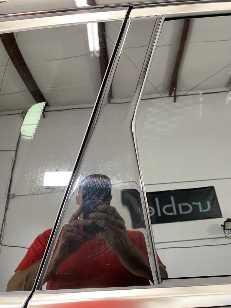 A man is taking a picture of himself in a mirror