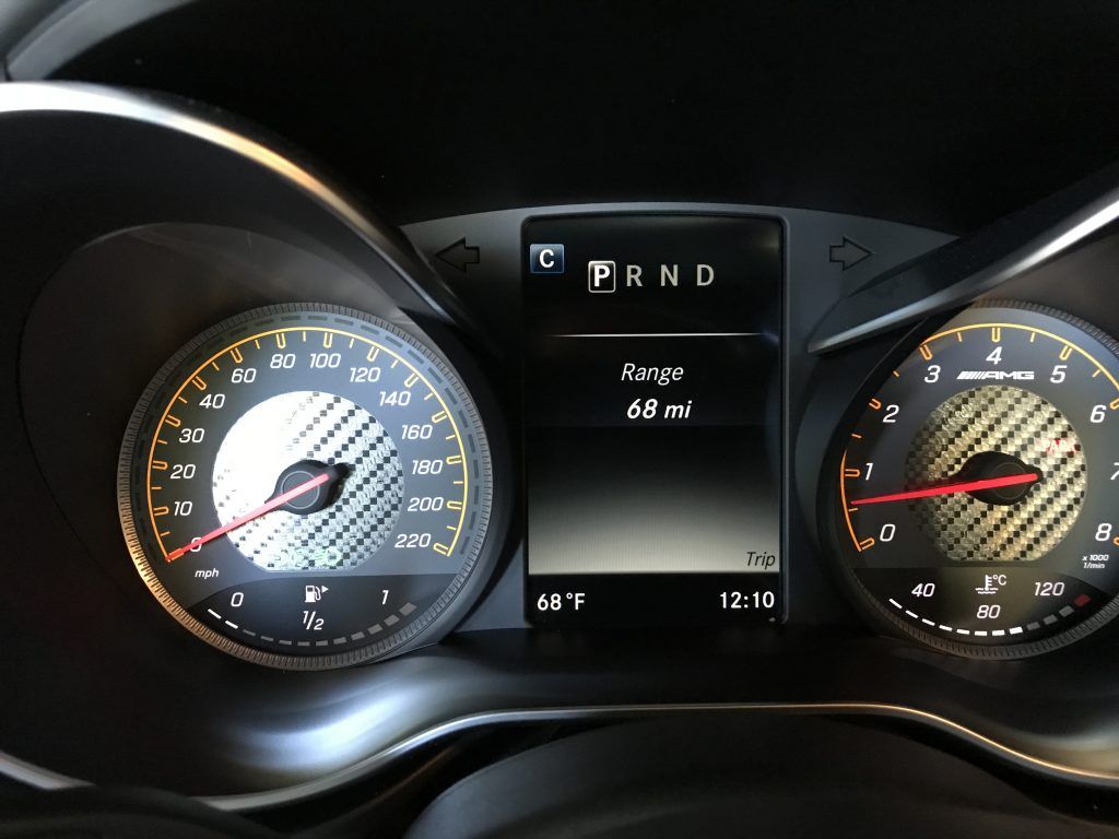 A close up of a car dashboard with the word prnd on it