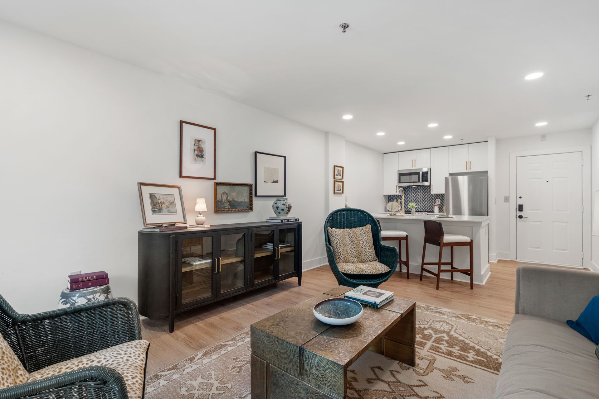 Beautifully decorated model home's open-concept living space at Clairmont Crest senior living apartments in Decatur, GA.