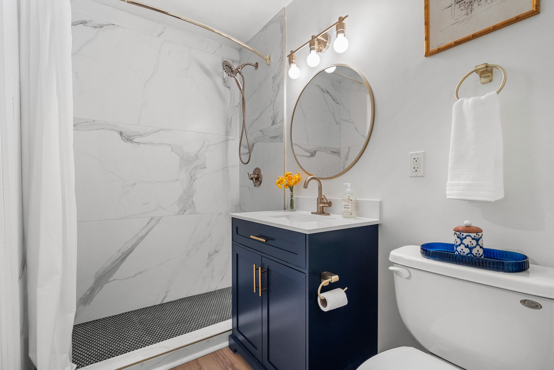Modern and well-lit bathroom in a model home at Clairmont Crest senior living apartments in Decatur, GA.