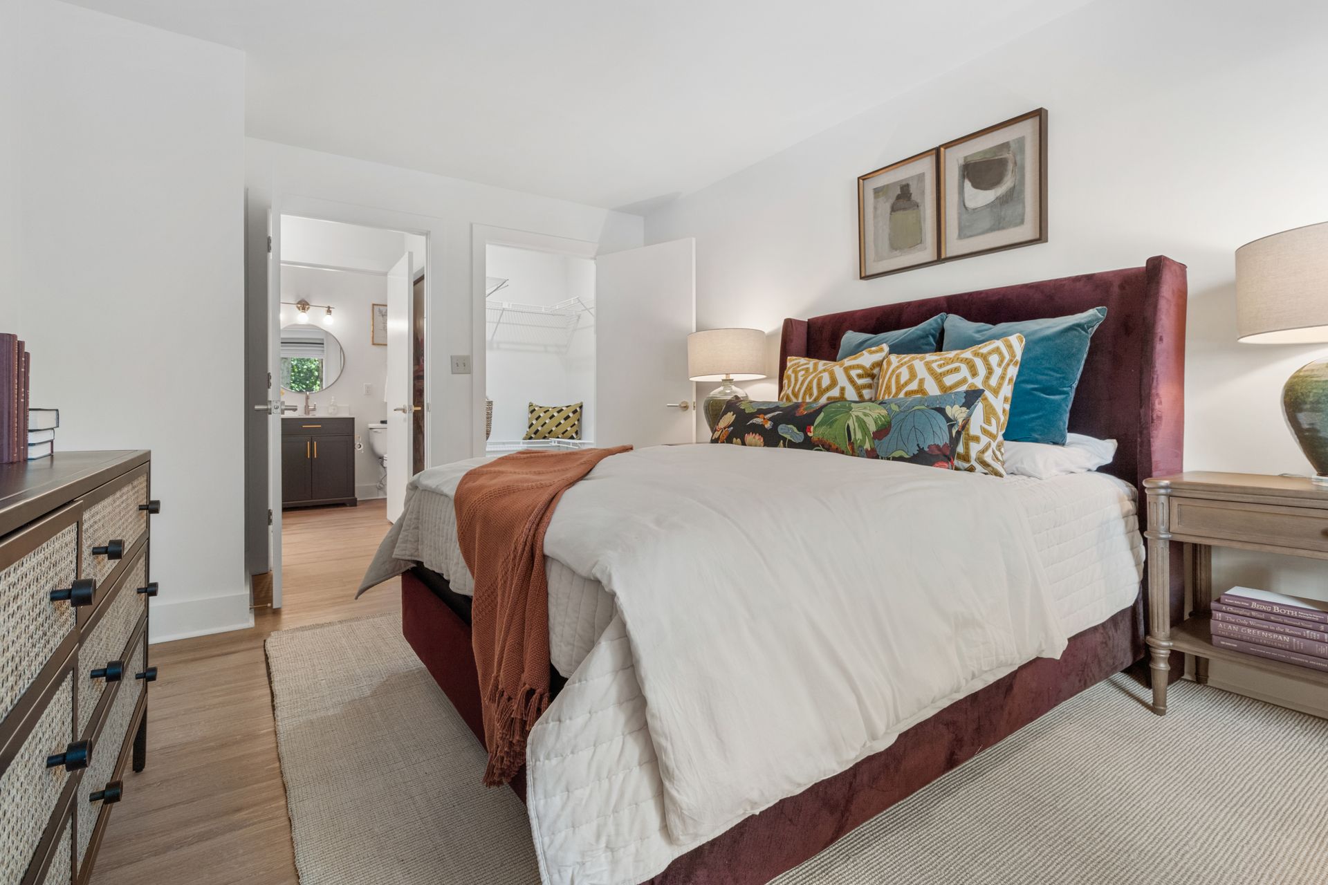 Well-furnished bedroom in a model home at Clairmont Crest senior living apartments in Decatur, GA.