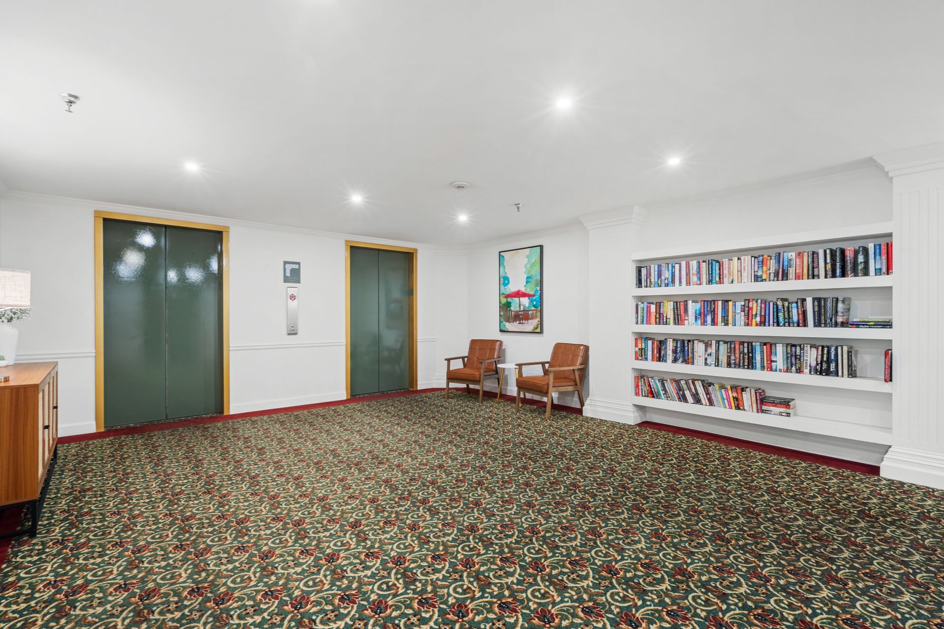 Well-stocked library at Clairmont Crest senior living apartments in Decatur, GA.