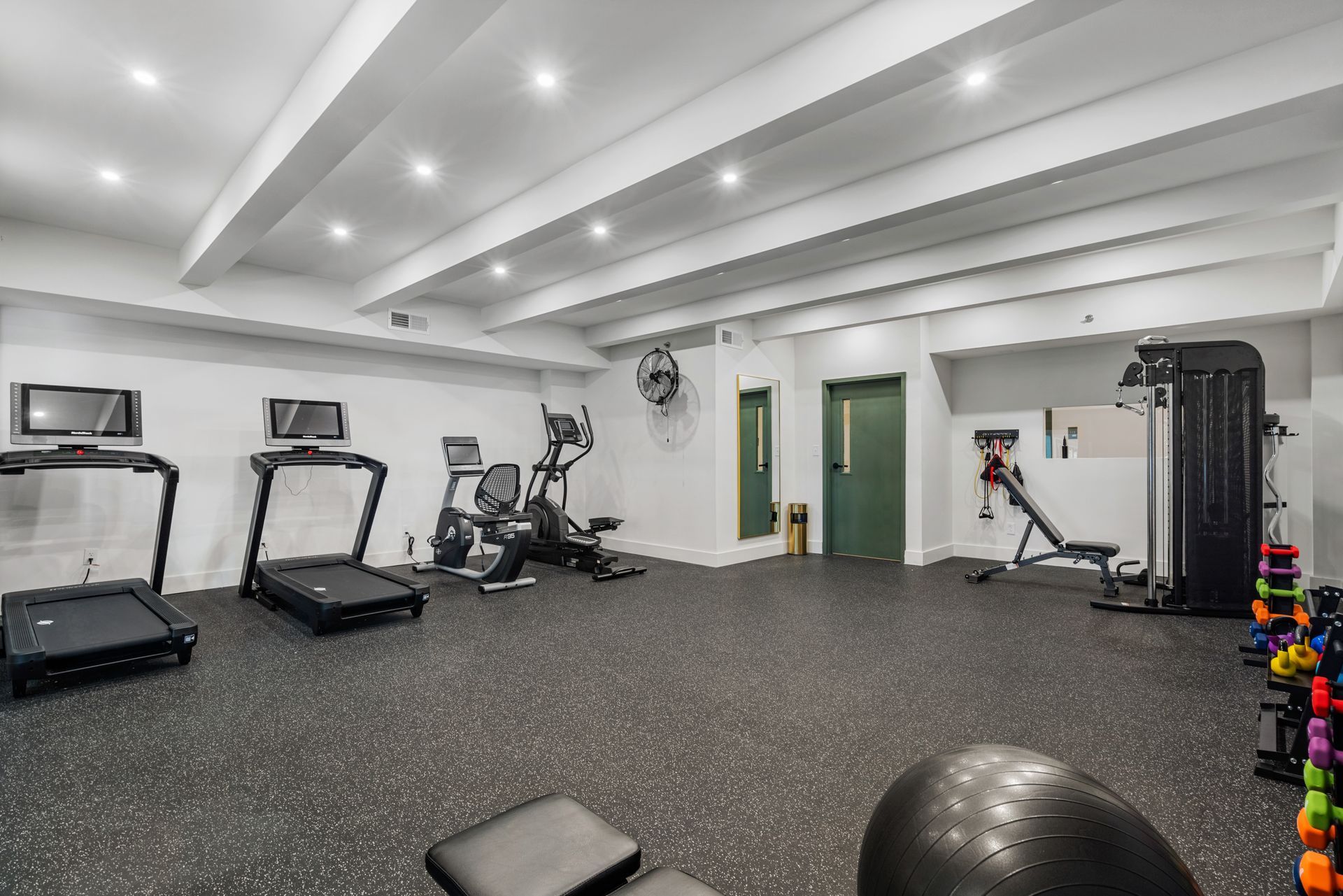 Well-equipped fitness center at Clairmont Crest senior living apartments in Decatur, GA.