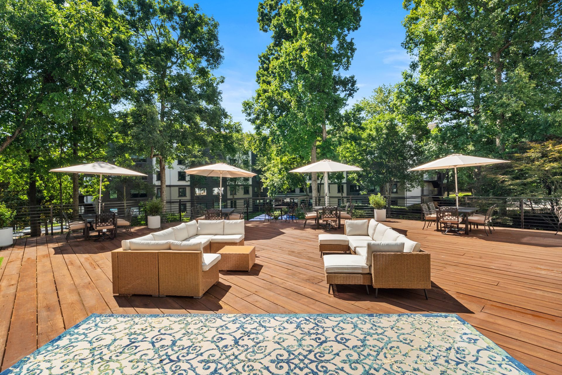 Deck lounge area on a beautiful day at Clairmont Crest senior living apartments in Decatur, GA.